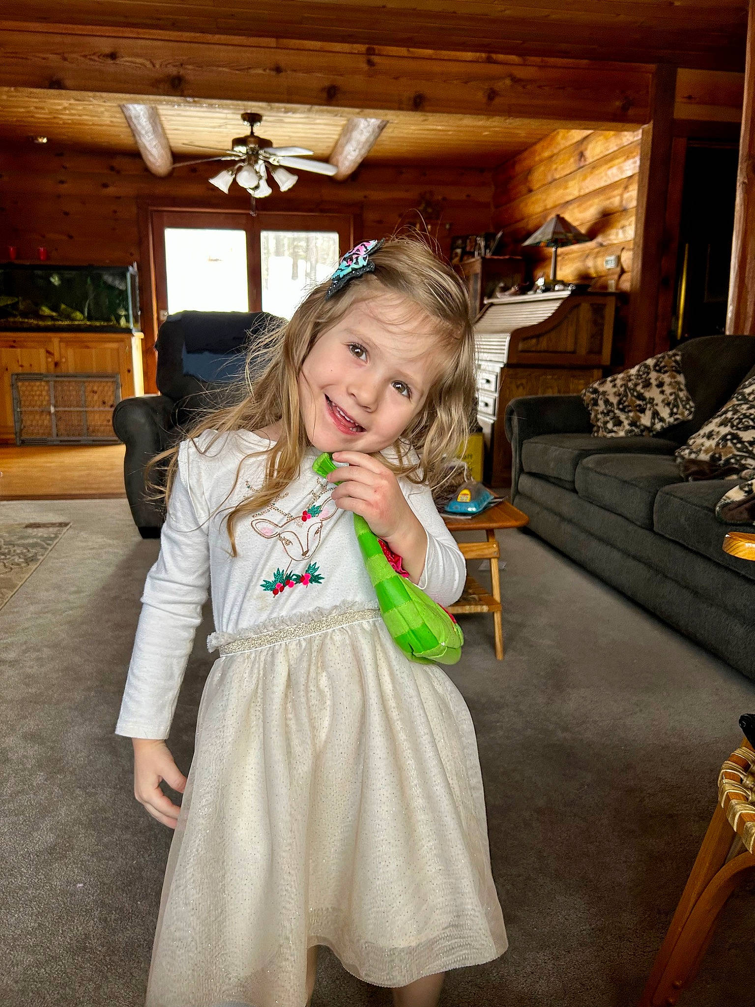 Alexis is registered to the contest to win money with this photo: child, couch, event, eye, flooring, formal_wear, fun, happy, joy, leisure, luxury_vehicle, mammal, person, plant, room, sitting, smile, toddler, tree, uniform