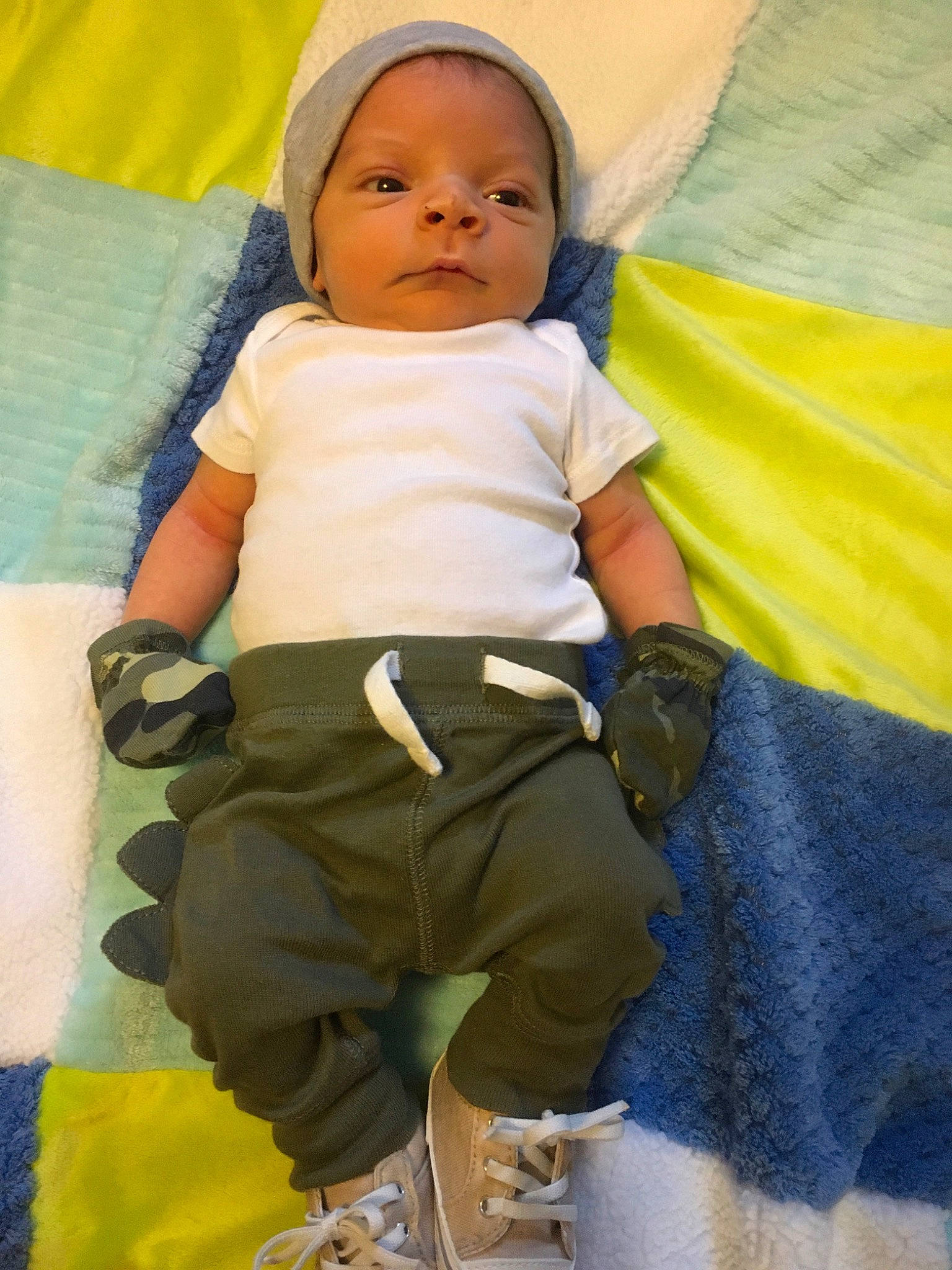 Sterling is registered to the contest to win money with this photo: baby, baby_products, baby_toddler_clothing, cheek, child, comfort, electric_blue, eye, fun, happy, leisure, linens, person, photograph, product, shorts, sitting, sleeve, t_shirt, textile