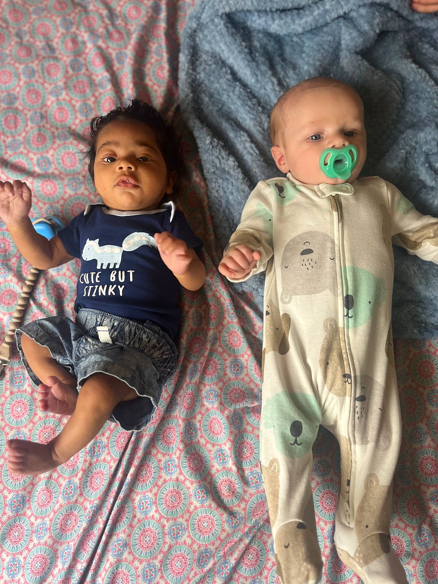 Tahj is registered to the contest to win money with this photo: arm, baby, baby_products, baby_toddler_clothing, cheek, child, comfort, cool, eye, face, facial_expression, gesture, happy, human_body, linens, pattern, person, skin, sleeve, textile