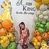 Janae joined the competition — help win amazing prizes! child, girl, balloons, party, celebration, colorful, wall_art, lion_king, decorations, playful, posing, floor, dress, indoor, smiling, birthday, festive, orange_balloons, green_balloons, yellow_balloons