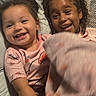 Janae joined the competition — help win amazing prizes! child, children, smile, happy, blanket, curly_hair, pajamas, bed, cuddle, closeup, portrait, indoor, playful, two_people, skin, face, family, fun, toddler, sibling