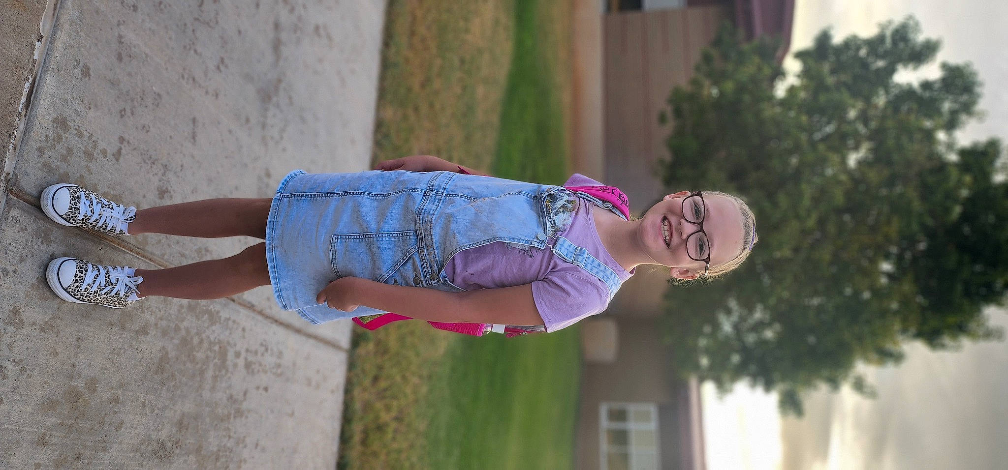 Serenity is registered to the contest to win money with this photo: abdomen, electric_blue, eyewear, fun, grass, happy, hat, human_leg, joy, leisure, magenta, person, pink, plant, purple, recreation, smile, thigh, tree, trunk