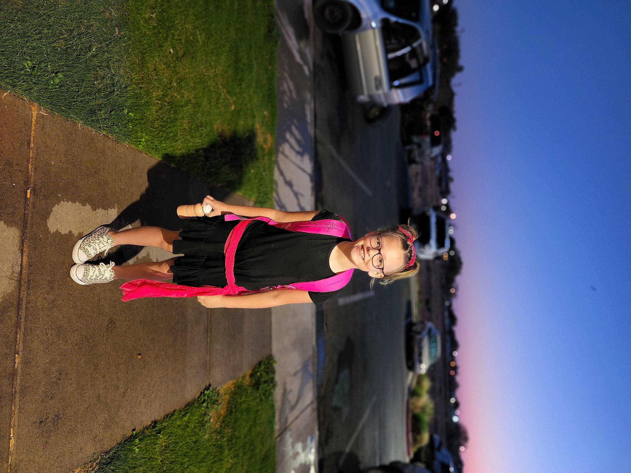 Serenity is registered to the contest to win money with this photo: arm, automotive_lighting, automotive_tire, bumper, car, electric_blue, footwear, fun, human_leg, joy, leisure, person, plant, recreation, sky, smile, thigh, tire, tree, vehicle