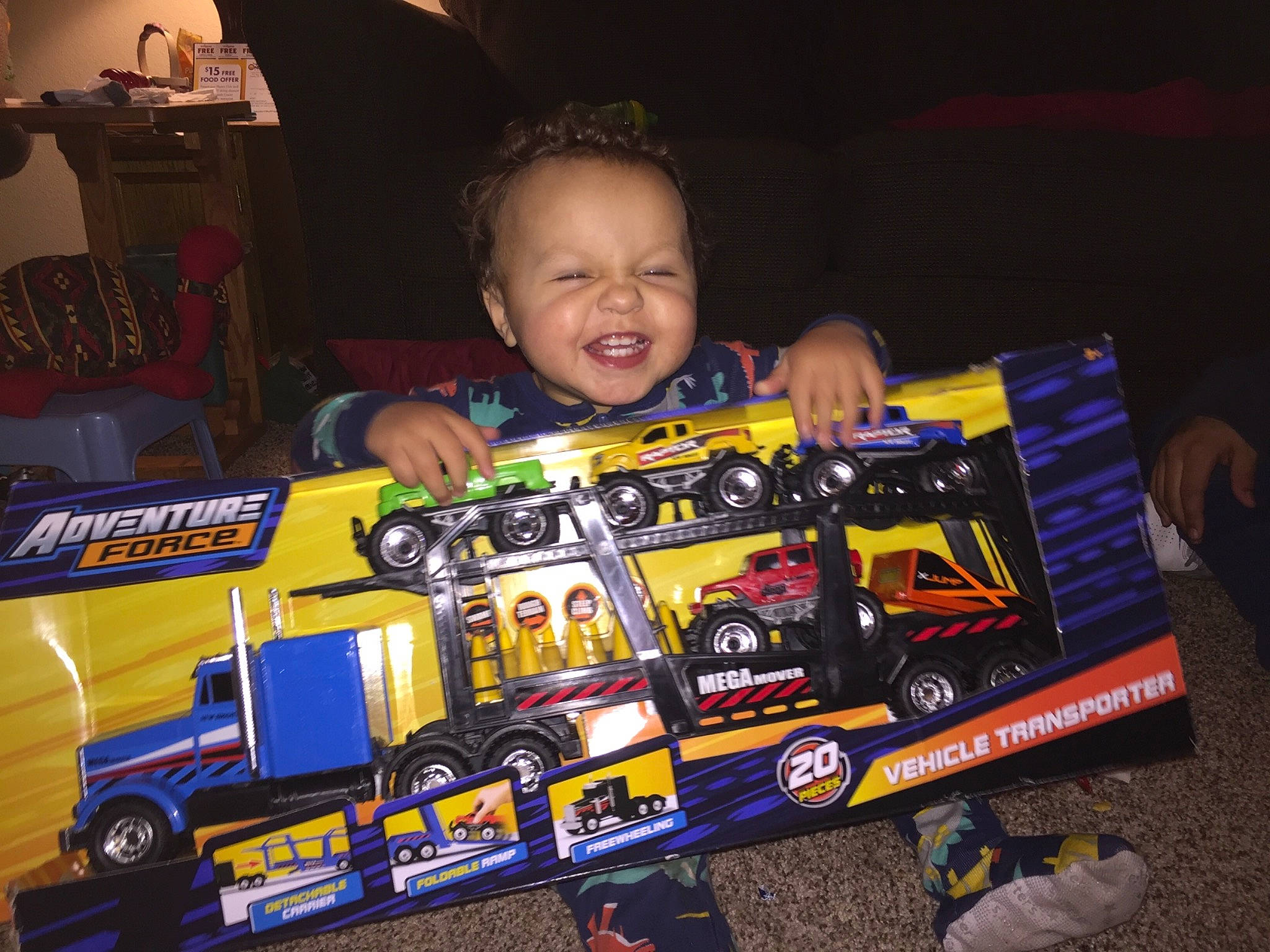 Brenton is registered to the contest to win money with this photo: car, joy, person, play_vehicle, product, race, toy, vehicle