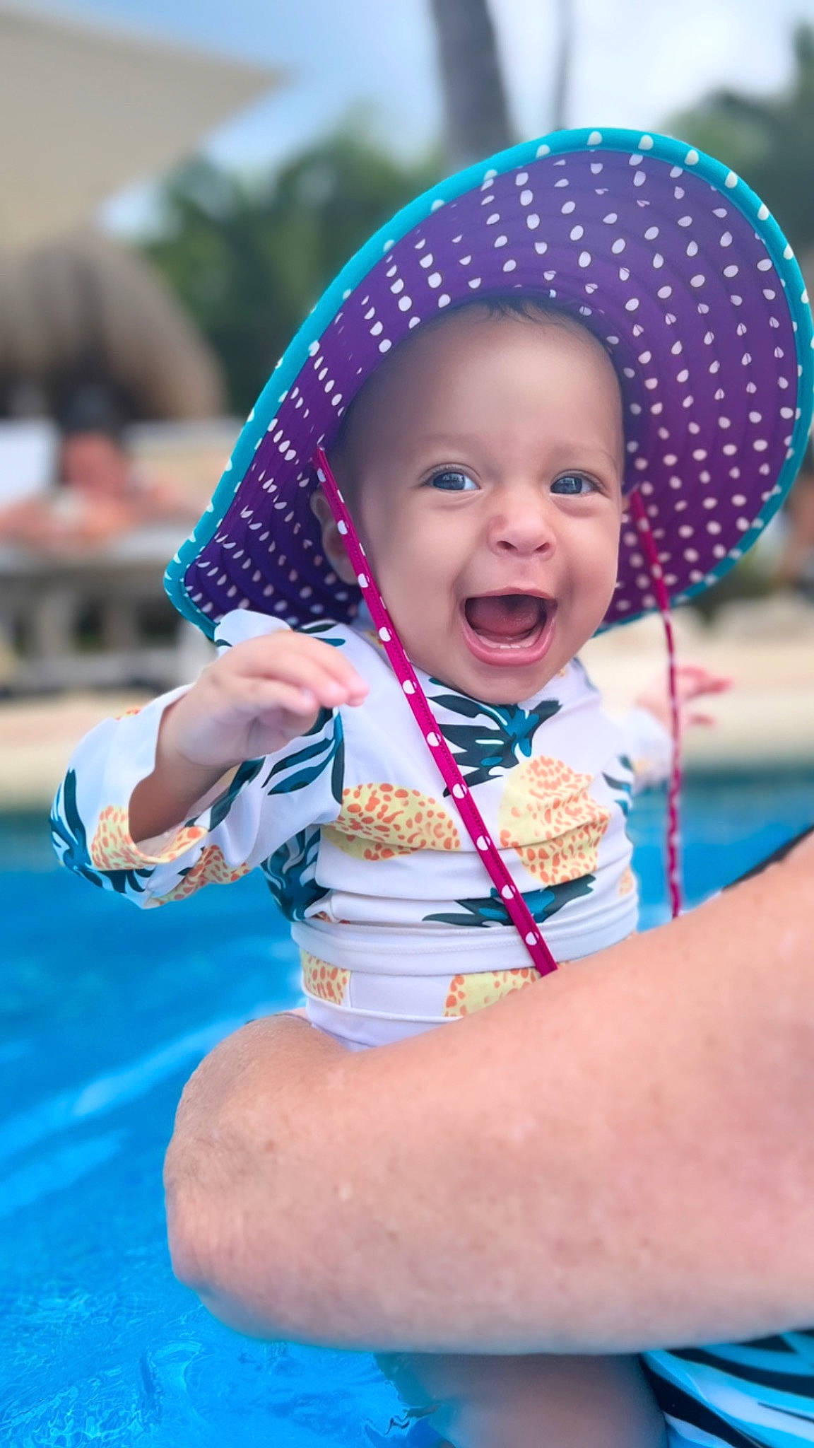 Kynsley is registered to the contest to win money with this photo: baby, baby_products, baby_toddler_clothing, child, electric_blue, fashion_accessory, fun, happy, headgear, human_body, jewellery, leisure, magenta, person, pink, play, recreation, sitting, skin, smile