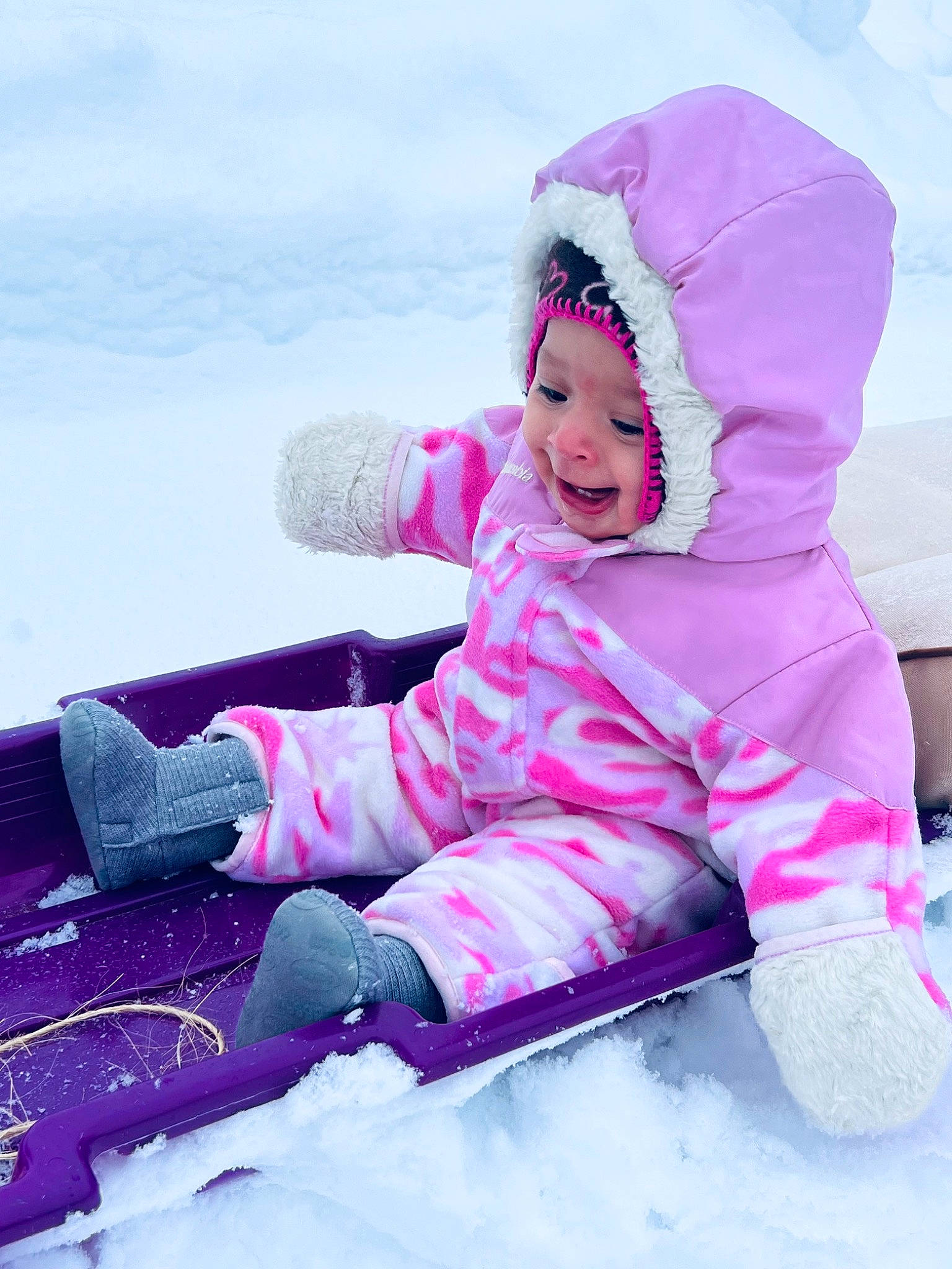 Kynsley joined the competition — help win amazing prizes! baby, baby_toddler_clothing, child, comfort, electric_blue, freezing, fun, happy, headwear, ice_cap, jacket, leisure, magenta, person, pink, purple, recreation, sitting, smile, snow