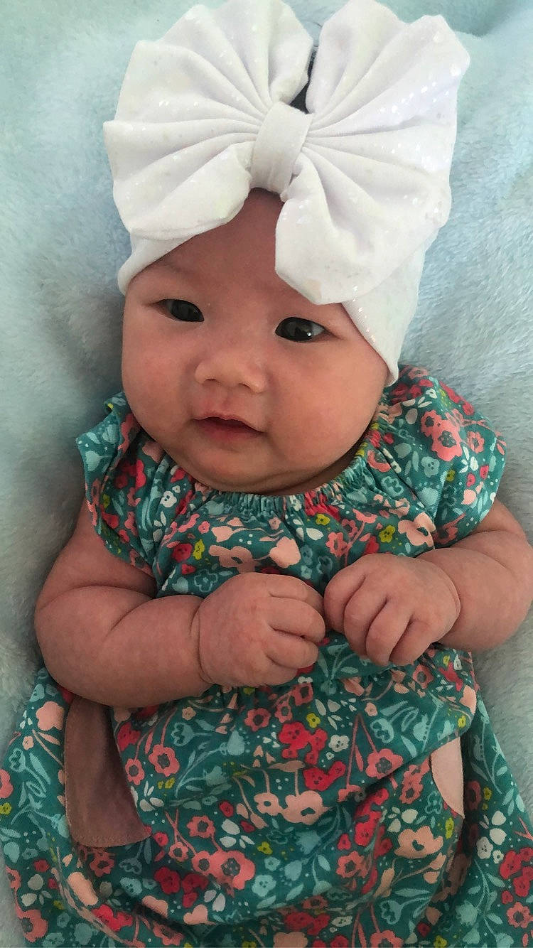 Ezri is registered to the contest to win money with this photo: baby, cheek, child, face, head, headgear, headwear, person, smile, toddler