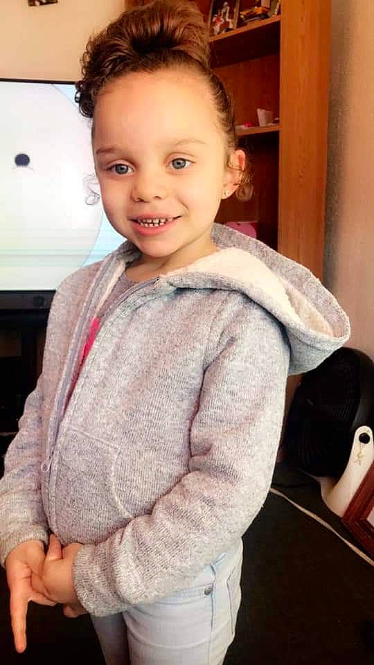 Ma'Riyah is registered to the contest to win money with this photo: arm, baby, cheek, child, child_model, ear, face, hair, head, joy, lip, neck, nose, outerwear, person, skin, sleeve, smile, sweater, toddler