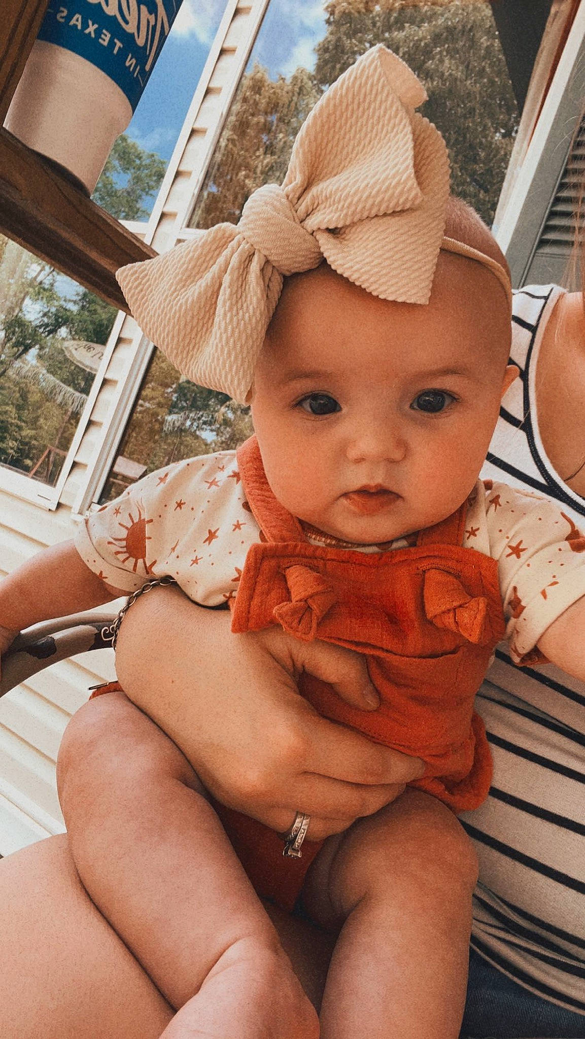 Kamryn is registered to the contest to win money with this photo: abdomen, baby, baby_toddler_clothing, cap, child, face, fawn, happy, hat, human_body, human_leg, leg, person, pink, plant, skin, sun_hat, thigh, toddler, trunk