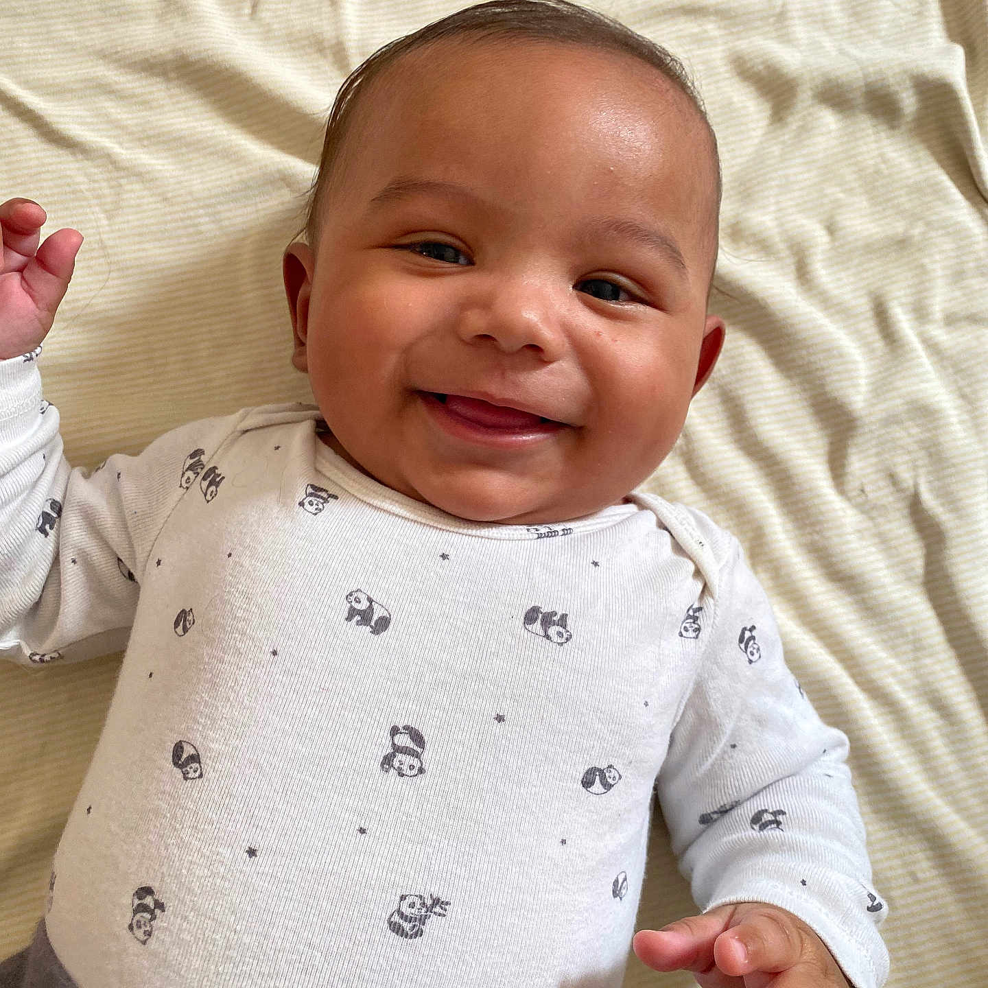 Trae is registered to the contest to win money with this photo: baby, babylaughing, bodypart, clothing, face, finger, hand, happy, head, laughing, newborn, pattern, person, photography, portrait, shirt, smile, wrist