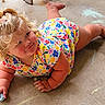 Millie-Jean is registered to the contest to win money with this photo: toddler, child, blonde_hair, curly_hair, floral_dress, chalk, chalk_drawings, concrete_floor, smile, cute, outdoor, playtime, colorful, holding, person, skin, legs, hands, happy, casual