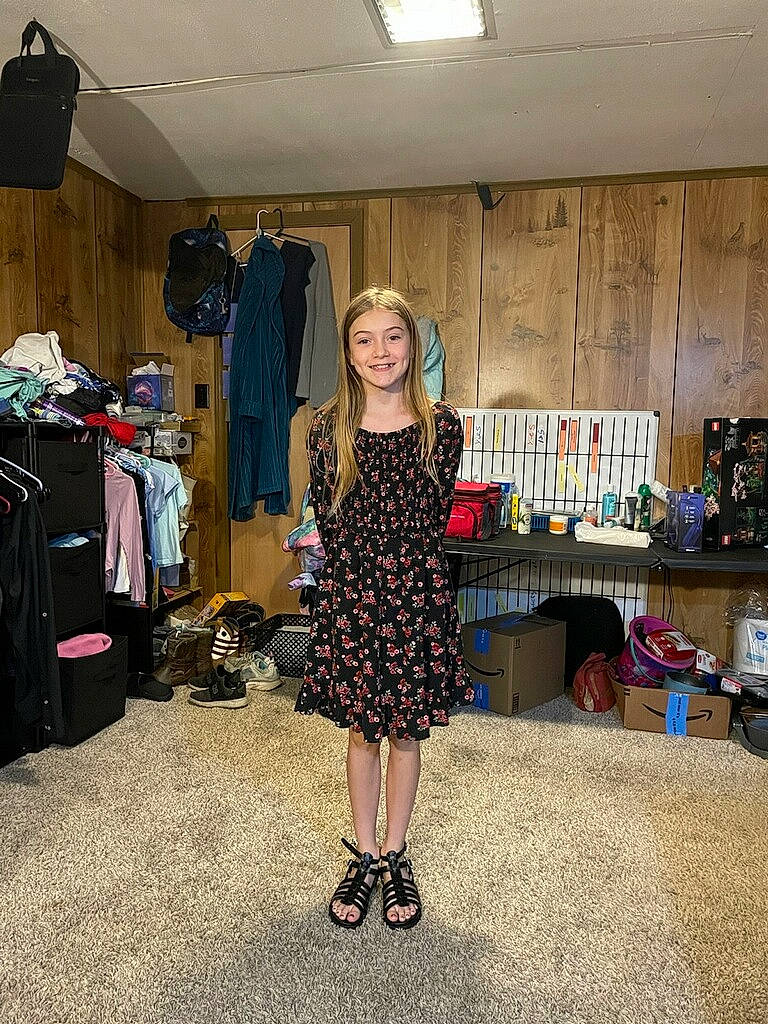 Averie is registered to the contest to win money with this photo: bag, boot, dress, event, eyewear, fashion_accessory, fashion_design, flooring, formal_wear, handbag, high_heels, human_leg, joy, knee, luggage_and_bags, one_piece_garment, person, sandal, smile, standing