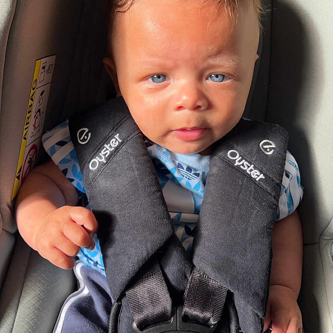 Jaylen-Amari is registered to the contest to win money with this photo: accessories, baby, belt, bodypart, car, clothing, cushion, face, finger, hand, head, homedecor, lifejacket, pants, person, photography, portrait, transportation, vehicle, vest
