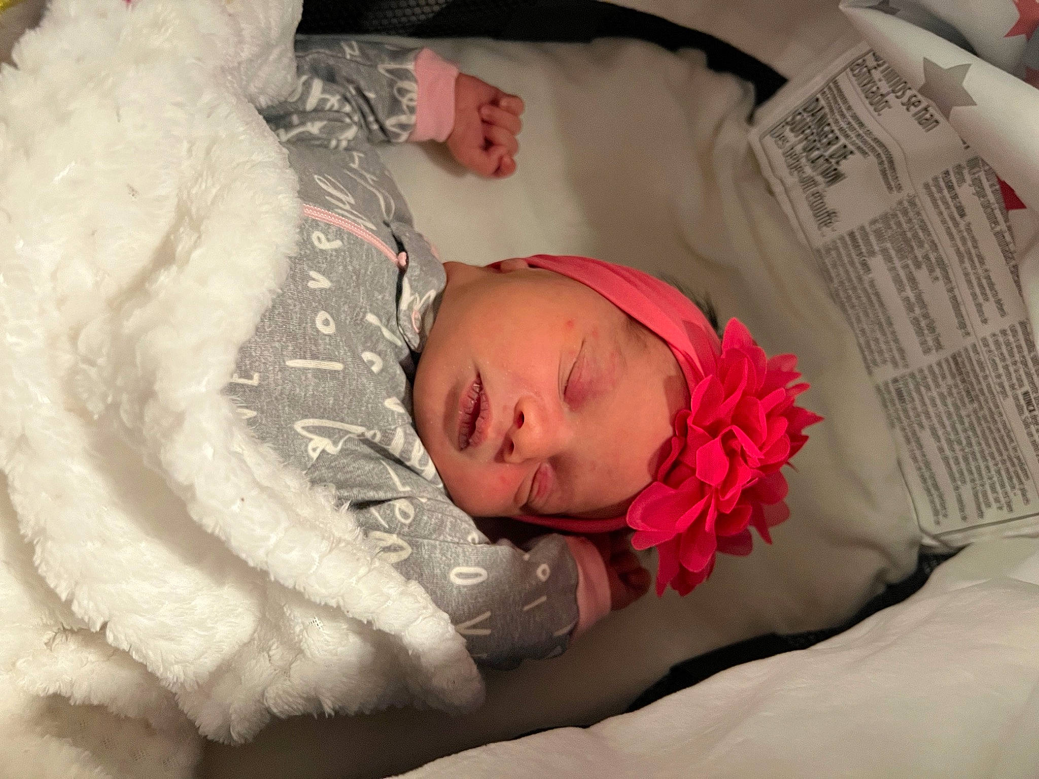Kaylani joined the competition — help win amazing prizes! arm, baby, baby_sleeping, baby_toddler_clothing, beauty, bedding, bedtime, child, comfort, finger, flower, fur, headwear, linens, newspaper, person, petal, pink, plant, skin