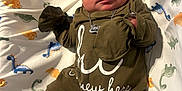 Nessiah joined the competition — help win amazing prizes! baby, blanket, child, clothing, cozy, cute, dinosaur_pattern, hat, indoors, infant, lying_down, mittens, necklace, newborn, pajamas, peaceful, portrait, sleeping, soft, white_socks