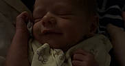 Bryce joined the competition — help win amazing prizes! baby, blanket, child, comfort, cozy, cute, face, hand, indoors, infant, newborn, pattern, peaceful, portrait, resting, sleeping, smile, soft_light, wrapped, young