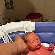 Bryce joined the competition — help win amazing prizes! newborn, baby, infant, bath, water, hand, support, tub, skin, wet, relaxing, indoor, wall, container, plumbing, person, closeup, parent, care, cleaning