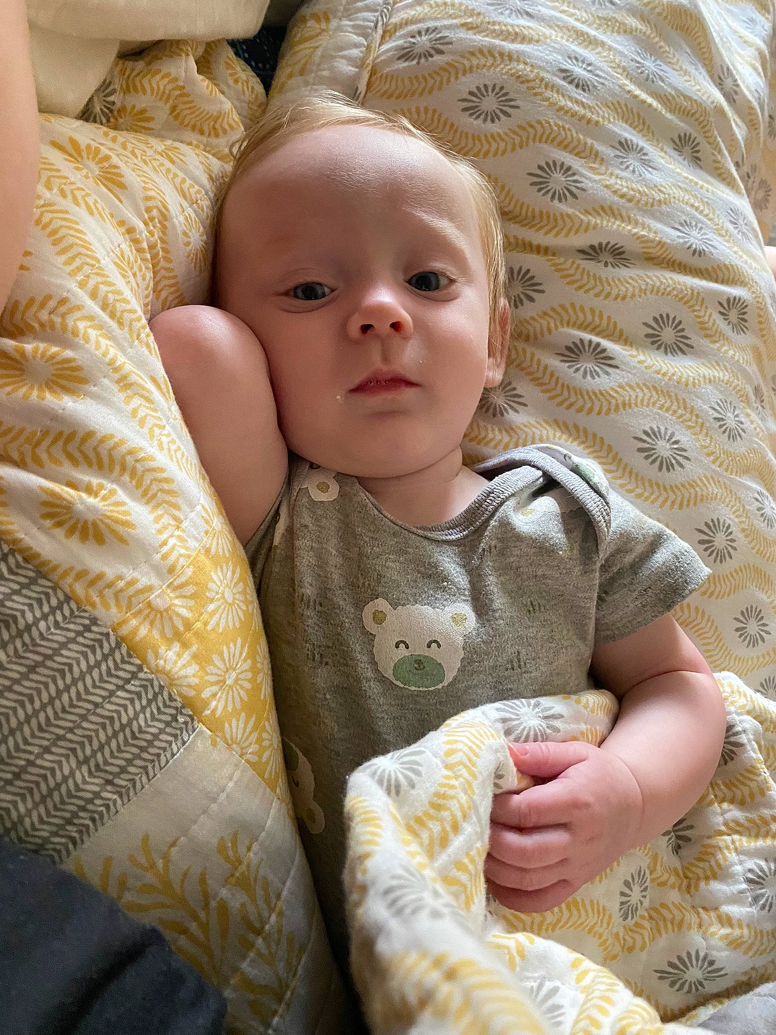 Callan joined the competition — help win amazing prizes! baby, baby_toddler_clothing, bedding, cheek, child, comfort, couch, flooring, fur, linens, nose, pattern, person, room, sitting, skin, sleeve, textile, toddler, wood