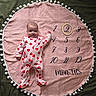 baby, infant, onesie, hearts, pink_blanket, pom_pom_trim, wooden_ring, numbers, months, milestone, smile, lying_down, face, cute, child, soft_texture, cozy, indoor, portrait, celebration