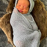 Levi Amiri joined the competition — help win amazing prizes! newborn, baby, sleeping, wrapped, blanket, knitted, hat, bear_ears, fur, cushion, cozy, soft, cute, infant, portrait, peaceful, resting, indoors, child, small
