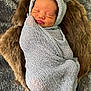 newborn, baby, sleeping, wrapped, blanket, knitted, hat, bear_ears, fur, cushion, cozy, soft, cute, infant, portrait, peaceful, resting, indoors, child, small