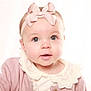 baby, bow, cardigan, child, clothing, cute, eyes, face, headband, infant, innocent, person, pink, portrait, smile, soft, studio, warm, white_background, young