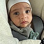 Nolan participe au concours pour gagner de l'argent avec cette photo : baby, blanket, bundle, car_seat, child, close_up, clothing, cozy, cute, expression, eyes, face, hat, indoor, infant, pacifier, portrait, soft_texture, warm, young_child