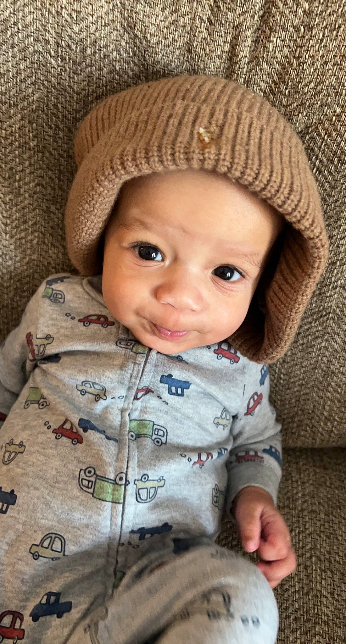 Greyson is registered to the contest to win money with this photo: baby, baby_toddler_clothing, cap, cheek, chin, clothing, collar, eye, face, head, headwear, iris, lip, nose, outerwear, person, photograph, product, skin, sleeve