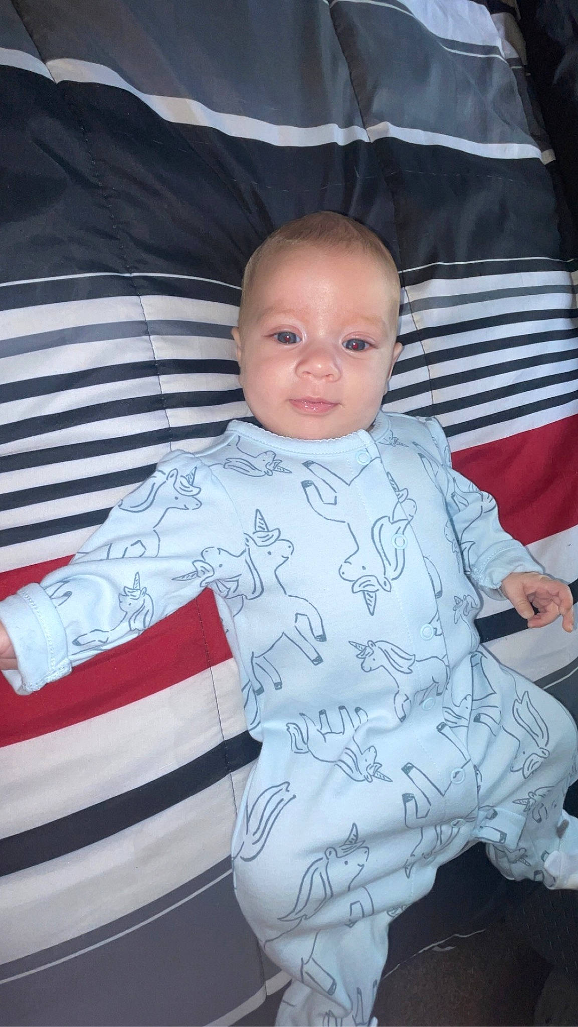 Dexter is registered to the contest to win money with this photo: automotive_design, baby, baby_carriage, baby_products, baby_toddler_clothing, car_seat, cheek, child, comfort, fun, pattern, person, product, room, sitting, sleeve, smile, standing, t_shirt, toddler