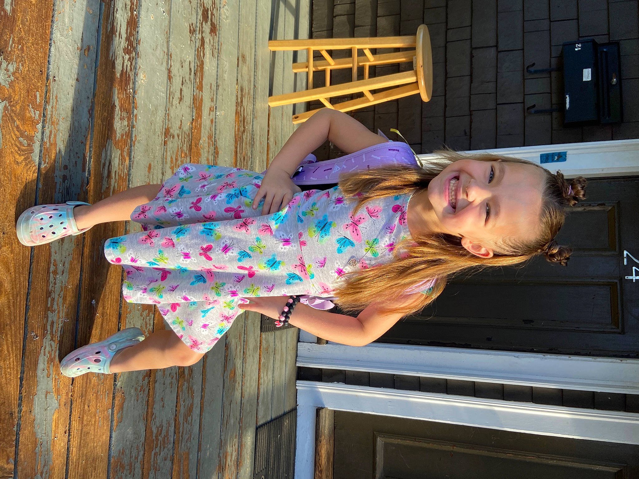 Kenna is registered to the contest to win money with this photo: electric_blue, fashion_design, fun, happy, human_leg, joy, leisure, magenta, pattern, person, purple, sitting, sunglasses, thigh, tree, waist, wood