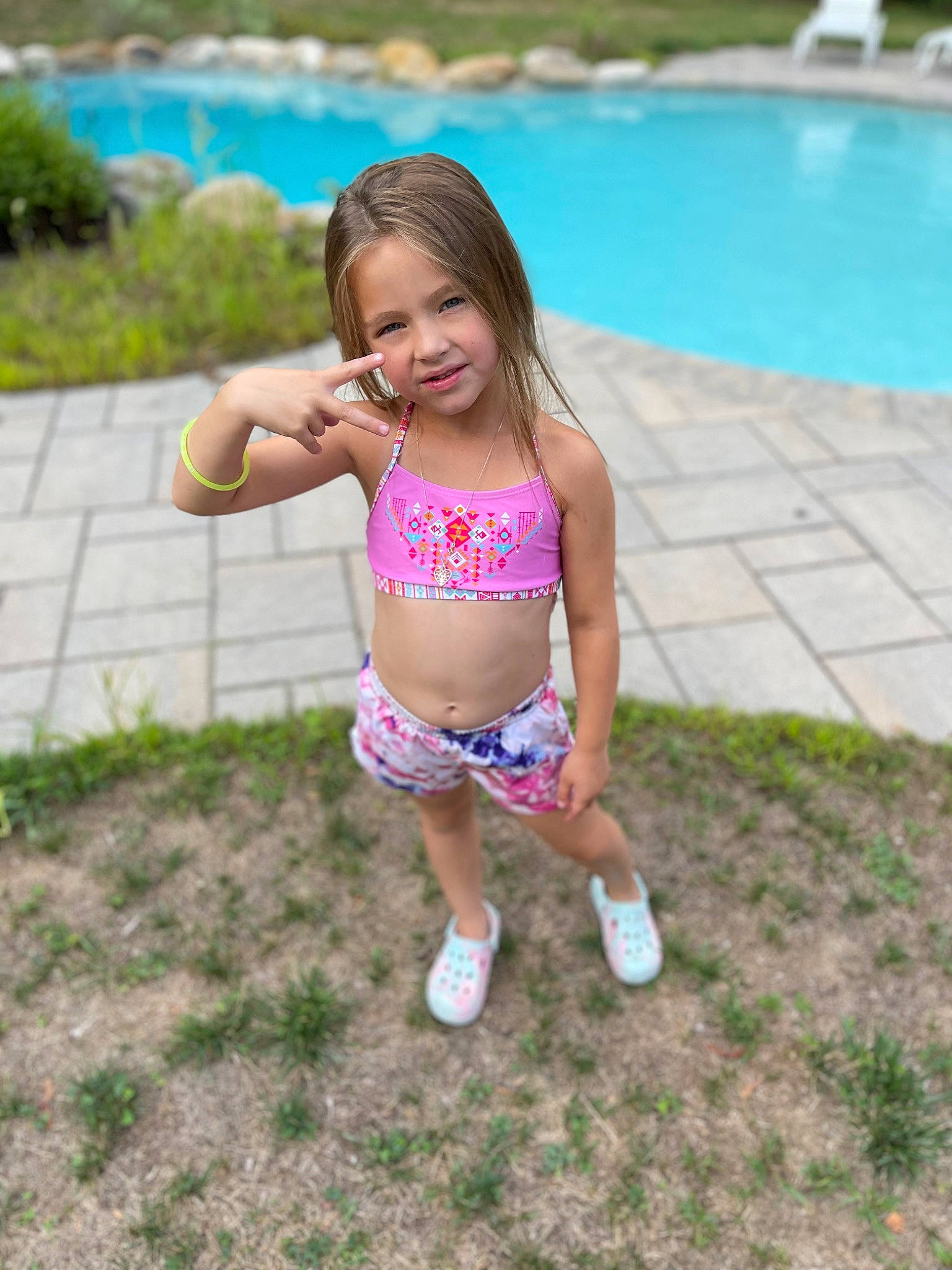 Kenna joined the competition — help win amazing prizes! black_hair, brassiere, chest, fun, grass, happy, leisure, person, plant, recreation, smile, summer, swimming_pool, swimsuit_top, swimwear, thigh, toddler, trunk, underpants, waist