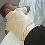 child, sleeping, bed, pillow, blanket, shirt, shorts, rest, indoors, peaceful, nap, young, person, relaxation, comfort, home, soft, cozy, clothing, lying_down