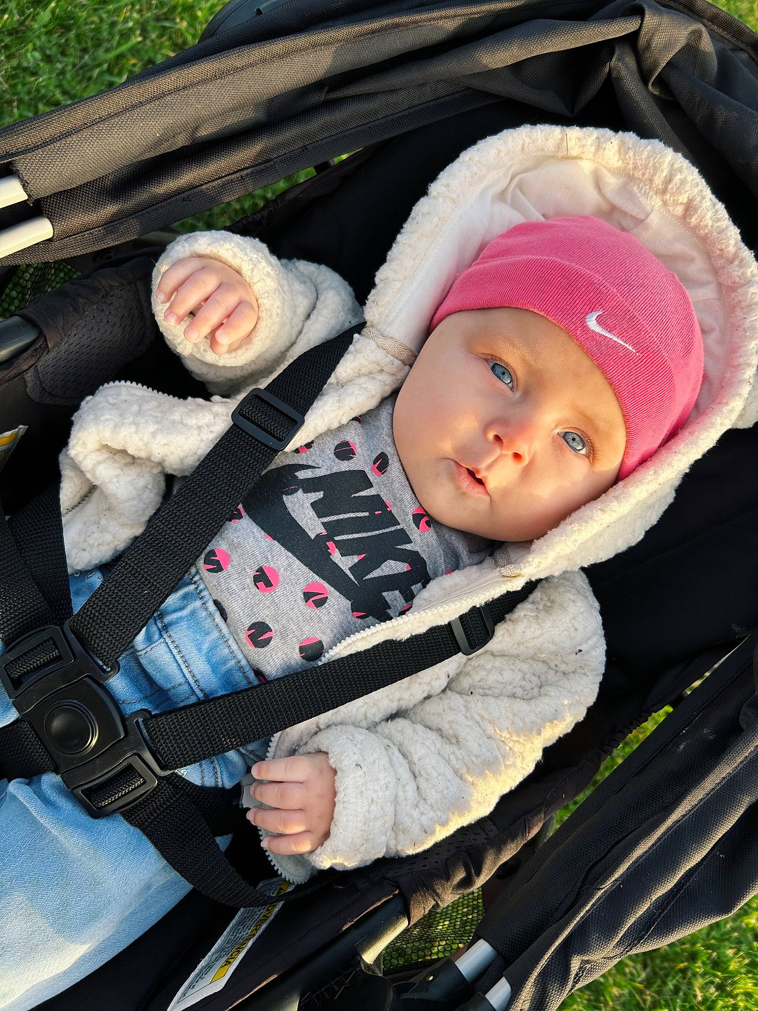 Maelynn joined the competition — help win amazing prizes! baby, baby_carriage, baby_products, baby_safety, baby_toddler_clothing, beanie, cap, car_seat, cheek, child, comfort, fashion_accessory, grass, hat, headgear, headwear, knit_cap, person, sitting, sleeve