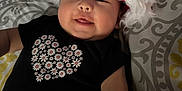 Amelia is registered to the contest to win money with this photo: applique, baby, bodypart, bonnet, cap, clothing, couch, face, finger, furniture, hand, happy, hat, head, newborn, pattern, person, photography, portrait, smile