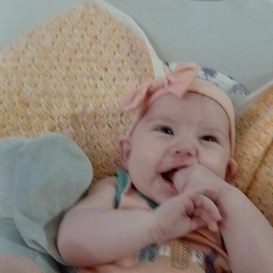 Amoura is registered to the contest to win money with this photo: accessories, baby, bed, bedroom, clothing, couch, cushion, face, furniture, happy, head, homedecor, indoors, jewelry, newborn, person, photography, portrait, room, smile
