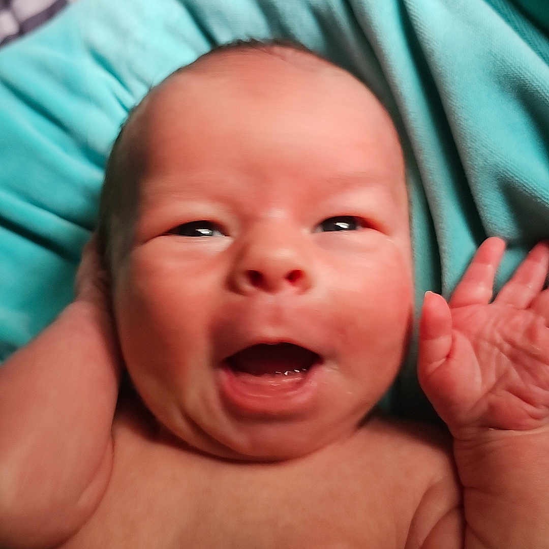 Zackary is registered to the contest to win money with this photo: baby, bodypart, face, finger, hand, head, mouth, newborn, person, photography, portrait