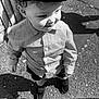 Ronnie is registered to the contest to win money with this photo: black_and_white, boy, cap, casual_clothing, child, curly_hair, cute, fashion, happy, outdoor, pavement, portrait, shadow, shirt, shoes, smile, standing, sunlight, vintage_style, young