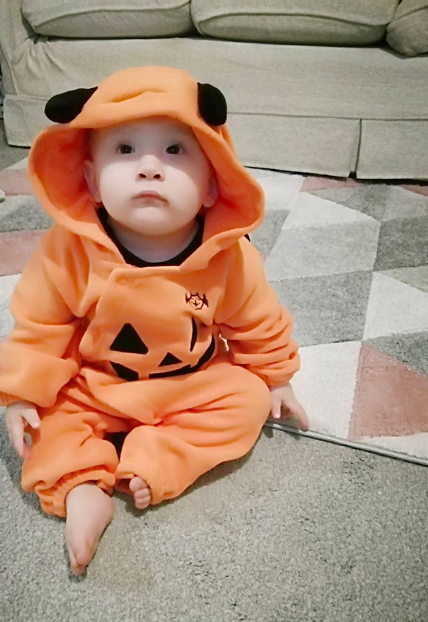 Jeffrey is registered to the contest to win money with this photo: baby, cheek, child, costume, headgear, headwear, outerwear, person, sleeve, smile, toddler