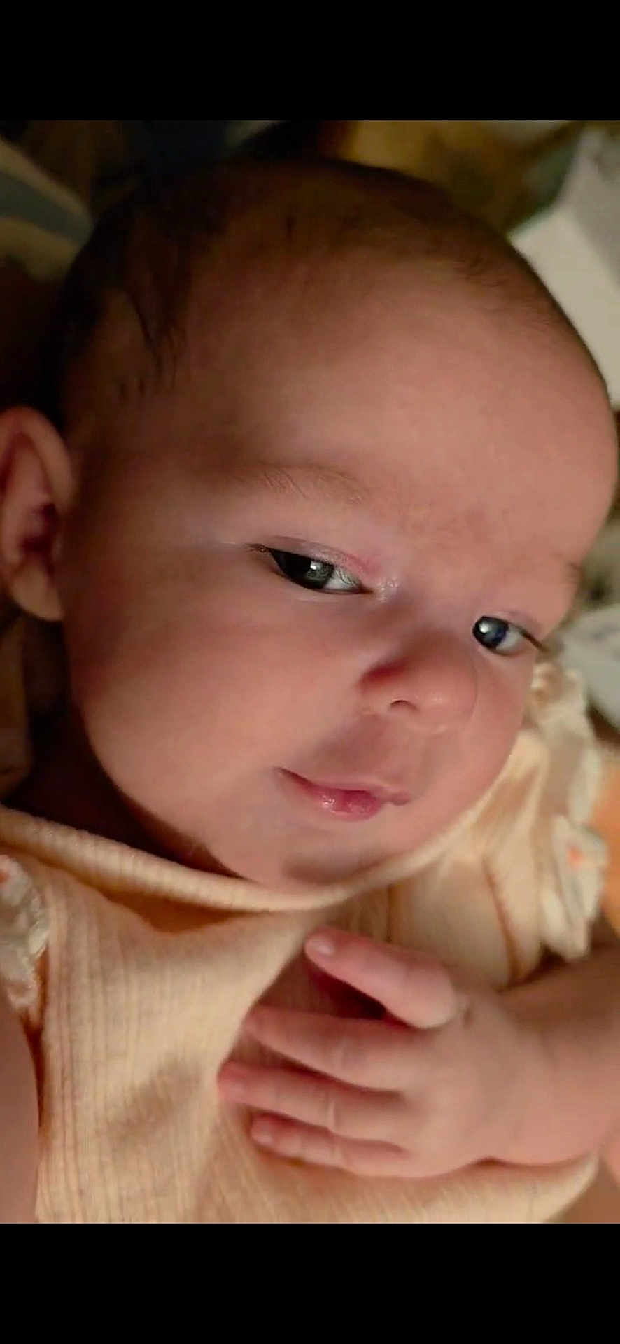 Athena joined the competition — help win amazing prizes! baby, infant, closeup, face, hand, skin, expression, newborn, cute, portrait, soft, clothing, child, young, person, resting, indoors, peaceful, gentle, sleepy