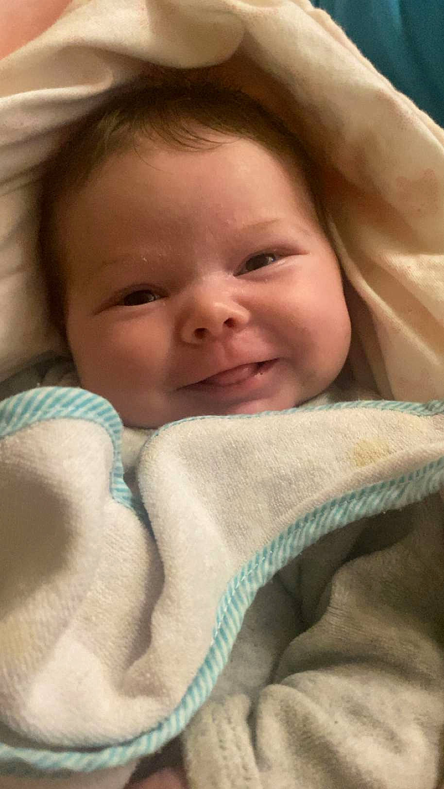 Railey participe au concours pour gagner de l'argent avec cette photo : baby, cheek, child, chin, comfort, eye, eyebrow, face, happy, head, iris, joy, linens, lip, mammal, mouth, nose, person, skin, smile