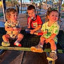 child, children, picnic_table, snack, outdoor, park, shelter, bench, sunlight, shadow, happy, smile, clothing, socks, shoes, metal, playground, summer, casual, cute