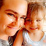 Aurora joined the competition — help win amazing prizes! adult, child, smiling, face, portrait, indoor, glasses, tank_top, phone, sparkles, happy, closeup, person, casual_clothing, family, together, hair, skin, light, freckles