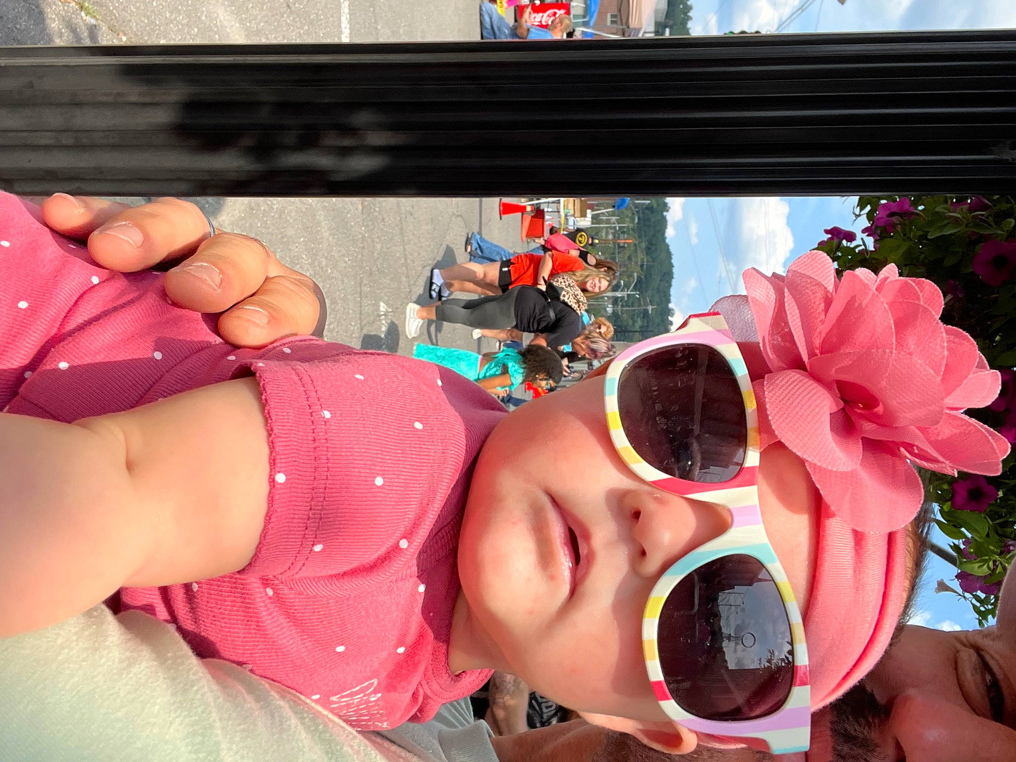 Ava is registered to the contest to win money with this photo: black_hair, blurred, child, cool, eyewear, flower, fun, glasses, goggles, happy, headwear, joy, leisure, lip, magenta, nail, person, petal, pink, plant