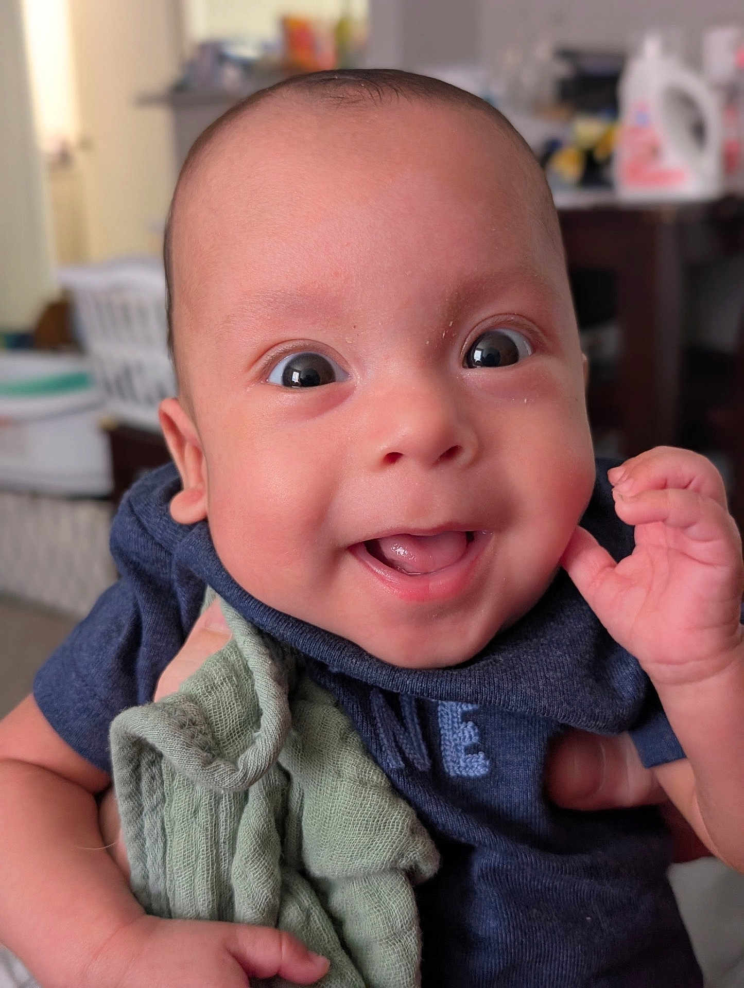 Ramon joined the competition — help win amazing prizes! baby, smile, face, child, infant, hand, blanket, clothing, indoors, portrait, happy, cute, skin, person, expression, head, eyes, mouth, newborn, toddler