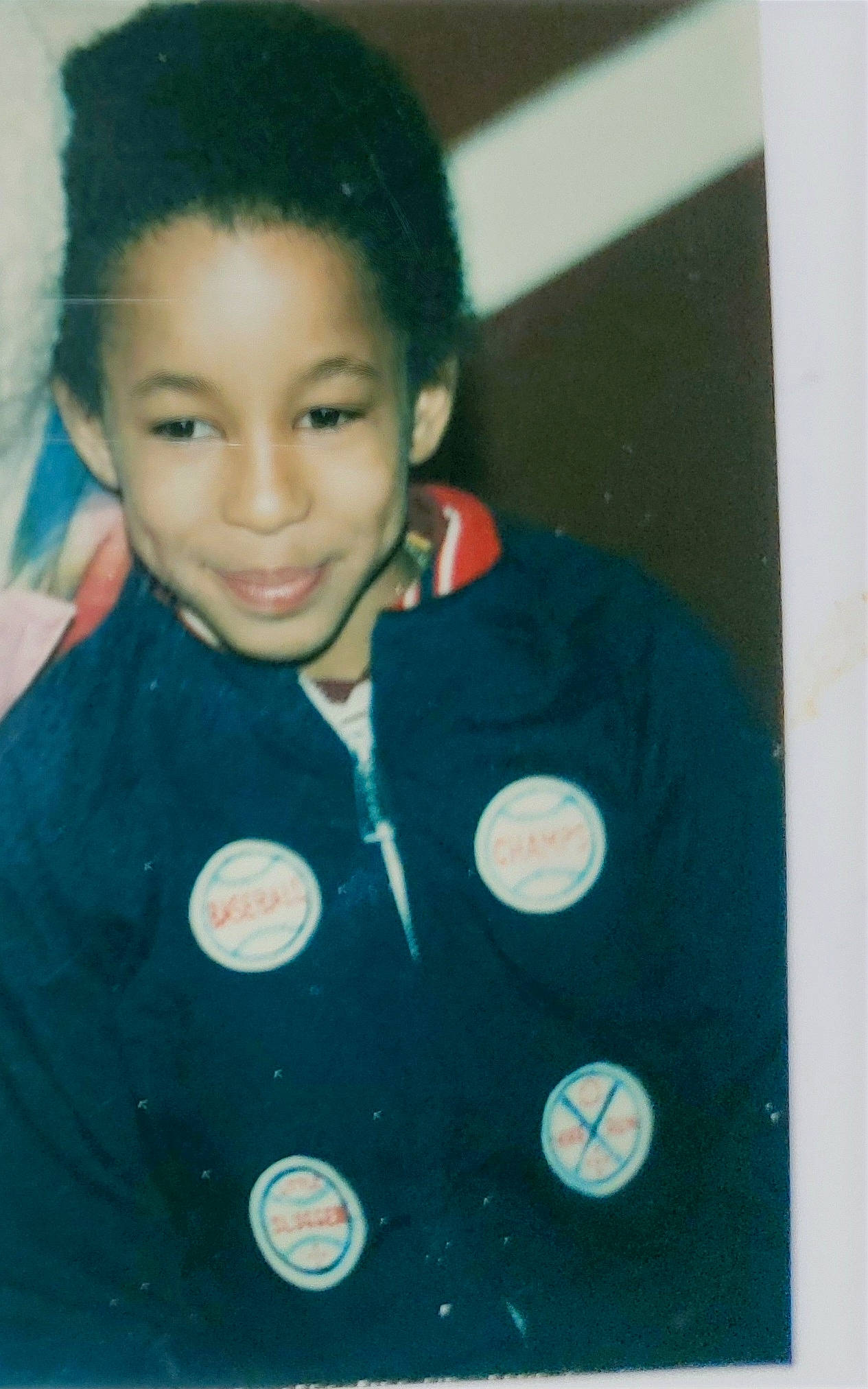 Corey is registered to the contest to win money with this photo: black_hair, button, cheek, child, cool, fun, happy, joy, person, portrait, s_curl, school_uniform, sleeve, smile, space, standing, t_shirt, toddler, uniform, vintage_clothing