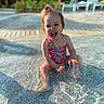 Vianna is registered to the contest to win money with this photo: toddler, child, water, pool, splashing, swimsuit, pink, cherry_pattern, happy, laughing, hair_tied, outdoor, sunny, resort, shallow_water, playful, summer, fun, person, young_child