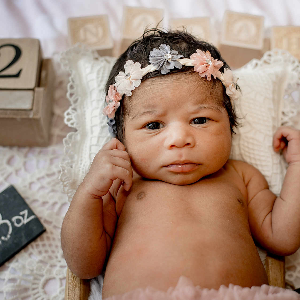 Nalah is registered to the contest to win money with this photo: baby, blanket, chalkboard, clock, cute, decor, eyes, face, flower_headband, hands, indoors, infant, lace, lying_down, newborn, portrait, skin, soft_lighting, weight_sign, wooden_blocks