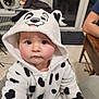 Théa participe au concours pour gagner de l'argent avec cette photo : baby, child, clothing, costume, curious, cute, dalmatian, eyes, face, floor, hand, hood, hoodie, indoor, person, rosy_cheeks, seated, soft_fabric, table, tile_floor