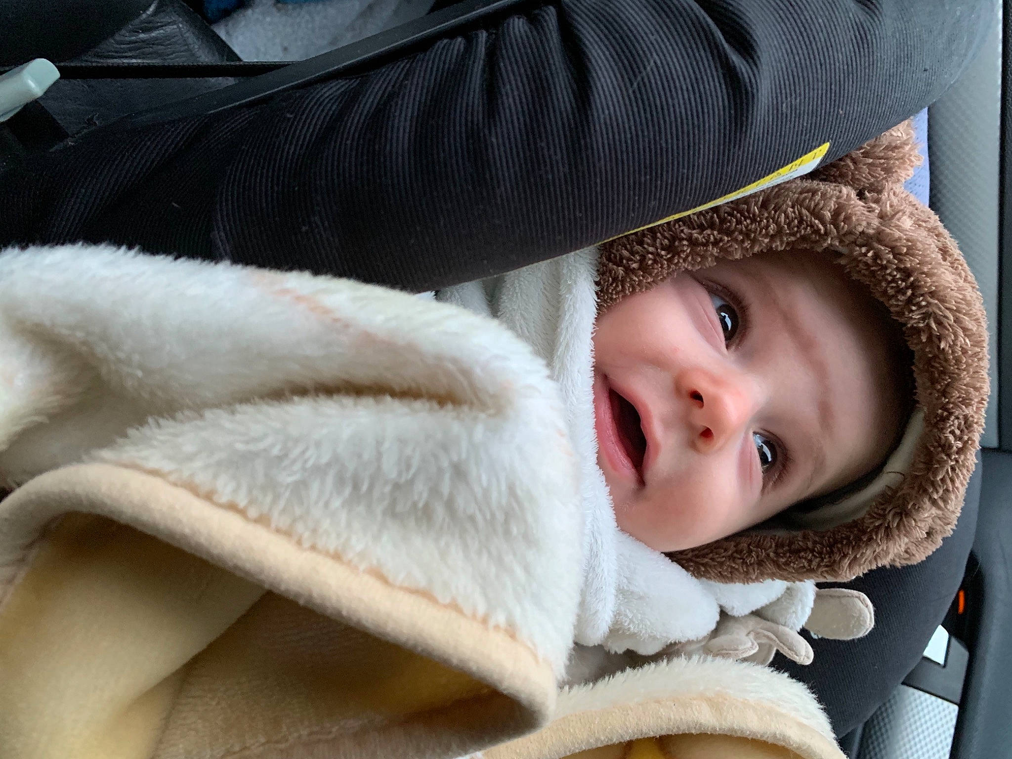 Mateï participe au concours pour gagner de l'argent avec cette photo : baby, cheek, comfort, eyelash, flash_photography, fur, fur_clothing, grey, happy, headgear, headwear, jacket, nose, outerwear, person, skin, sleeve, smile, textile, toddler