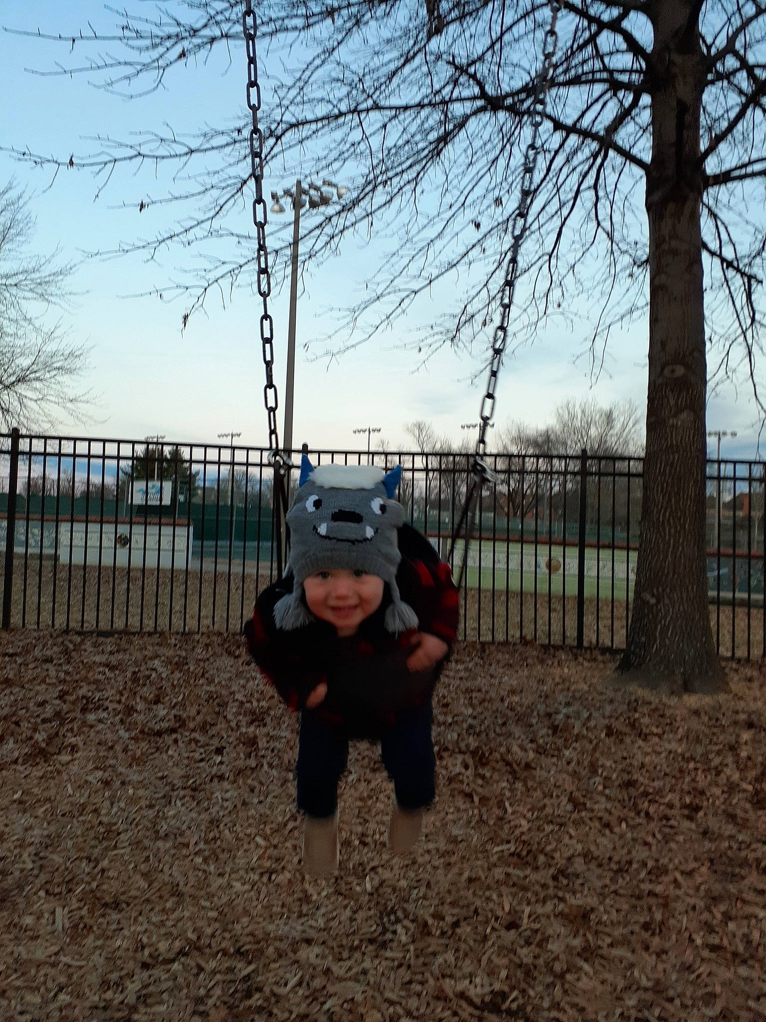 Creedence joined the competition — help win amazing prizes! child, fun, headwear, joy, landscape, leg, outdoor_play_equipment, person, plant, play, playground, recreation, sky, style, swing, tree, winter